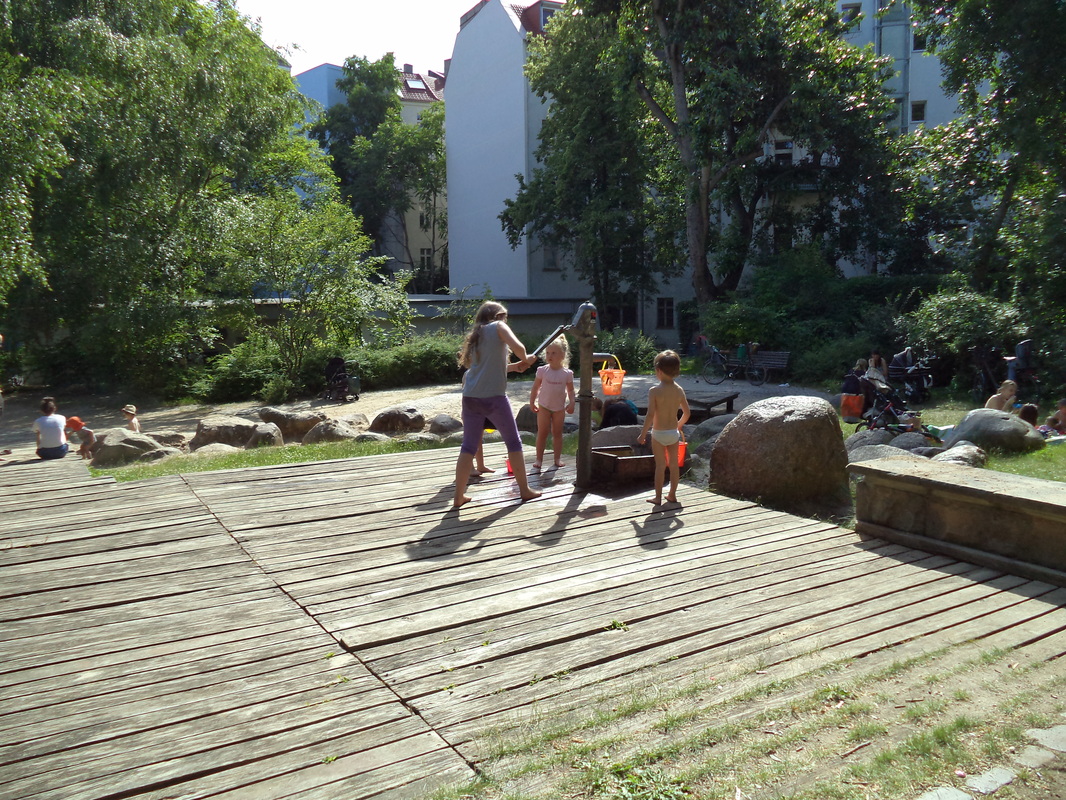 Natural Play area design - water play, timber deck, sand and water play